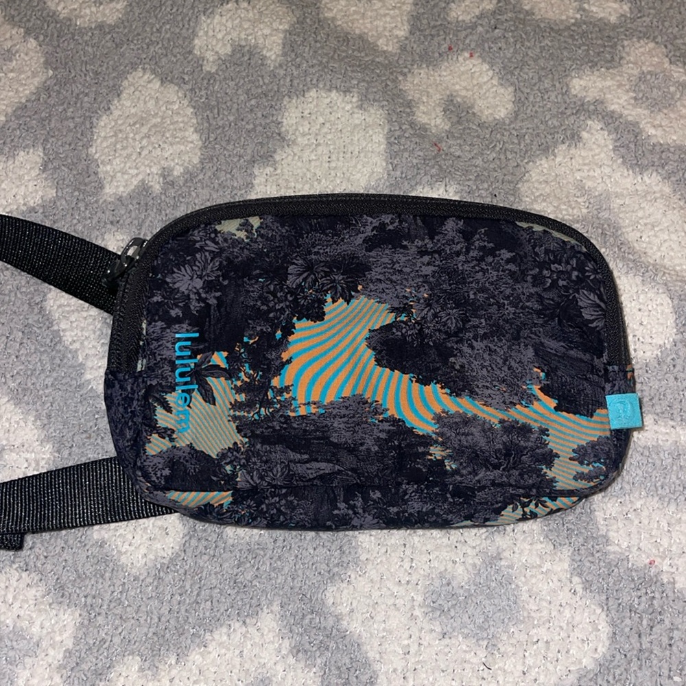 Mini Lululemon belt bag, orange and teal with black and gray design excellent co